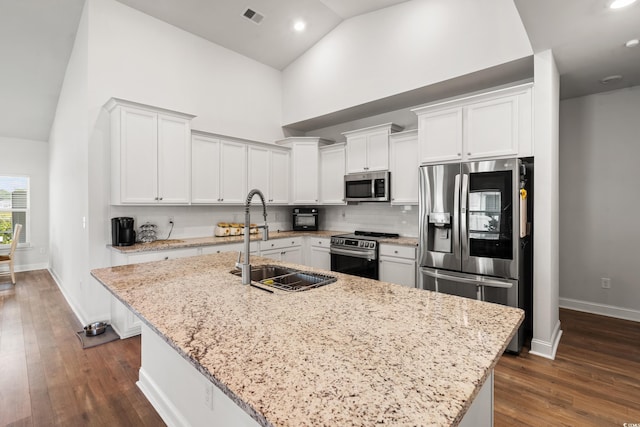 892 Harrison Mill St, Myrtle Beach, SC 29579 - kitchen featuring stainless steel appliances, high vaulted ceiling, light stone countertops, white cabinetry, and dark wood finished floors
