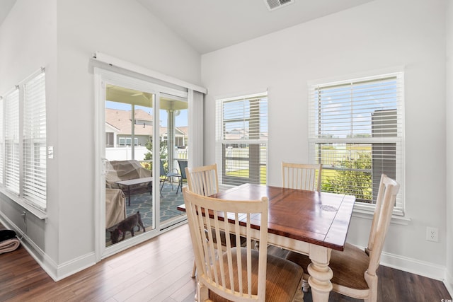 892 Harrison Mill St, Myrtle Beach, SC 29579 - dining area featuring vaulted ceiling, wood finished floors, and plenty of natural light