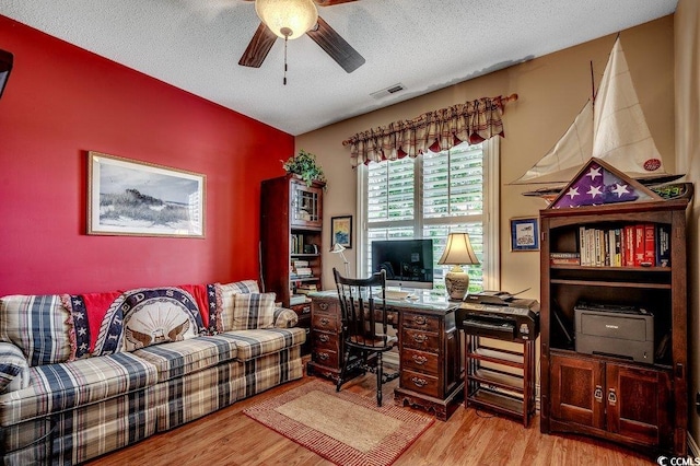 911 Tilghman Forest Dr, North Myrtle Beach, SC 29582 - office area featuring ceiling fan, wood finished floors, and a textured ceiling