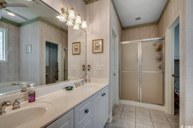 911 Tilghman Forest Dr, North Myrtle Beach, SC 29582 - full bathroom featuring a shower stall, double vanity, tile patterned flooring, wallpapered walls, and ceiling fan