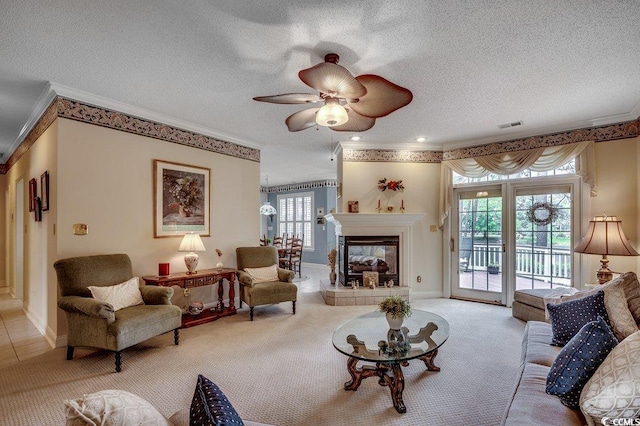 911 Tilghman Forest Dr, North Myrtle Beach, SC 29582 - carpeted living room featuring ornamental molding, a textured ceiling, healthy amount of natural light, a ceiling fan, and a multi sided fireplace