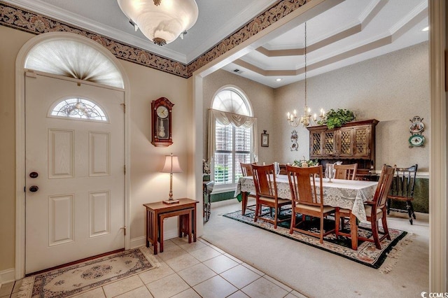 911 Tilghman Forest Dr, North Myrtle Beach, SC 29582 - foyer featuring crown molding, light tile patterned floors, a chandelier, and light colored carpet