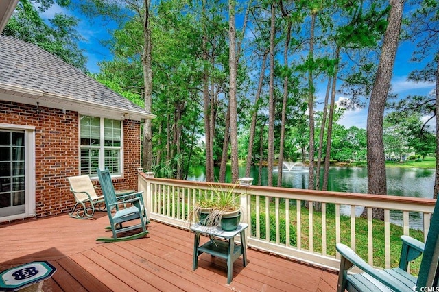 911 Tilghman Forest Dr, North Myrtle Beach, SC 29582 - deck with a water view and view of scattered trees