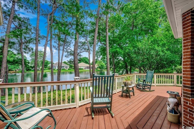 911 Tilghman Forest Dr, North Myrtle Beach, SC 29582 - deck featuring a water view and view of wooded area