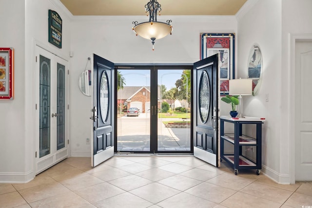 5904 Bridlewood Rd, North Myrtle Beach, SC 29582 - foyer entrance featuring french doors, light tile patterned floors, and crown molding