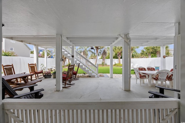 30462NDAVE N 62nd Ave N, North Myrtle Beach, SC 29582 - fenced backyard with outdoor dining space, a patio, and stairway