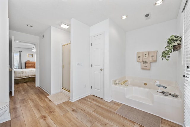 30462NDAVE N 62nd Ave N, North Myrtle Beach, SC 29582 - bathroom with a bath, a stall shower, ensuite bathroom, wood finished floors, and recessed lighting