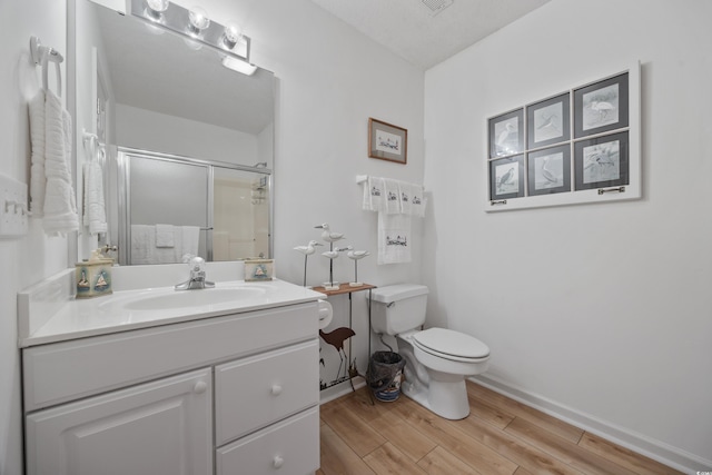 30462NDAVE N 62nd Ave N, North Myrtle Beach, SC 29582 - bathroom with wood finished floors, a shower with door, and vanity