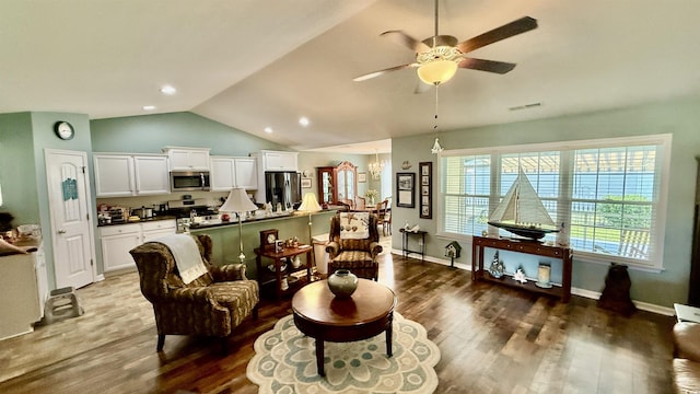 1300 Ruddy Ct, Conway, SC 29527 - living room with wood finished floors, vaulted ceiling, a ceiling fan, a chandelier, and recessed lighting
