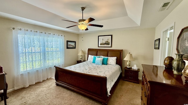 1300 Ruddy Ct, Conway, SC 29527 - carpeted bedroom with a tray ceiling and a ceiling fan
