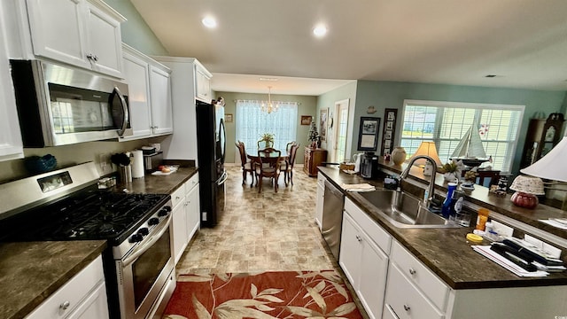 1300 Ruddy Ct, Conway, SC 29527 - kitchen featuring stainless steel appliances, a chandelier, dark countertops, white cabinetry, and recessed lighting