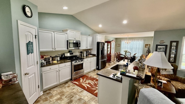 1300 Ruddy Ct, Conway, SC 29527 - kitchen featuring appliances with stainless steel finishes, a chandelier, white cabinetry, plenty of natural light, and lofted ceiling