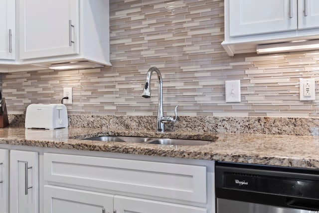 6624 Lagoon Pl, Myrtle Beach, SC 29572 - kitchen with dishwasher, white cabinets, and backsplash