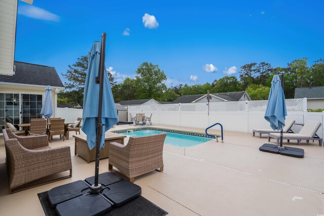 2395 Morlynn Dr, Myrtle Beach, SC 29577 - view of swimming pool featuring outdoor dining space, a patio area, and a fenced backyard