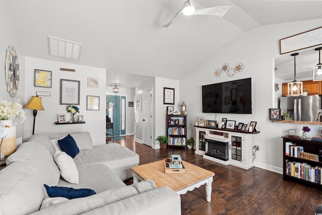 2395 Morlynn Dr, Myrtle Beach, SC 29577 - living room featuring ceiling fan, vaulted ceiling, dark wood-type flooring, and a fireplace