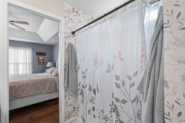 2395 Morlynn Dr, Myrtle Beach, SC 29577 - ensuite bathroom with wood finished floors, a ceiling fan, and a shower with curtain