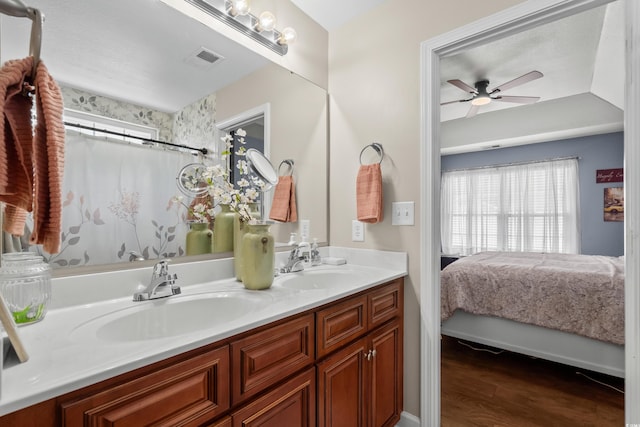 2395 Morlynn Dr, Myrtle Beach, SC 29577 - ensuite bathroom featuring double vanity, ceiling fan, and wood finished floors