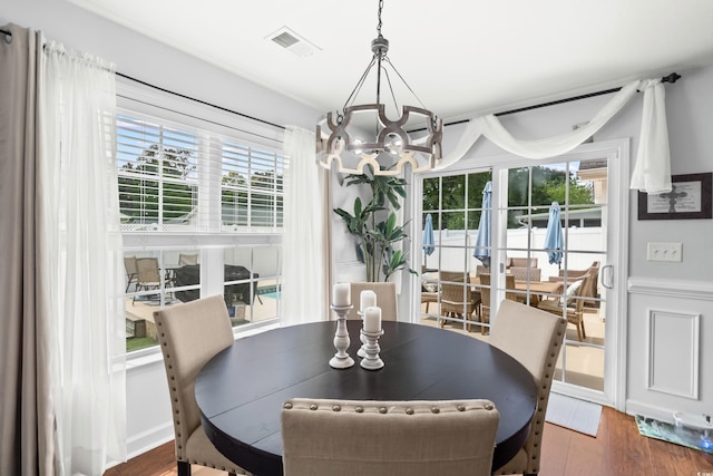 2395 Morlynn Dr, Myrtle Beach, SC 29577 - dining area with a chandelier, plenty of natural light, and wood finished floors