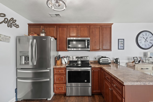 2395 Morlynn Dr, Myrtle Beach, SC 29577 - kitchen with stainless steel appliances, a peninsula, and dark wood finished floors