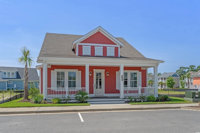 8148 Living Tide Dr, Myrtle Beach, SC 29572 - bungalow-style house featuring a porch and roof with shingles