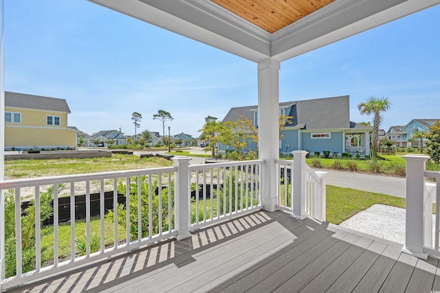 8148 Living Tide Dr, Myrtle Beach, SC 29572 - wooden porch featuring a residential view