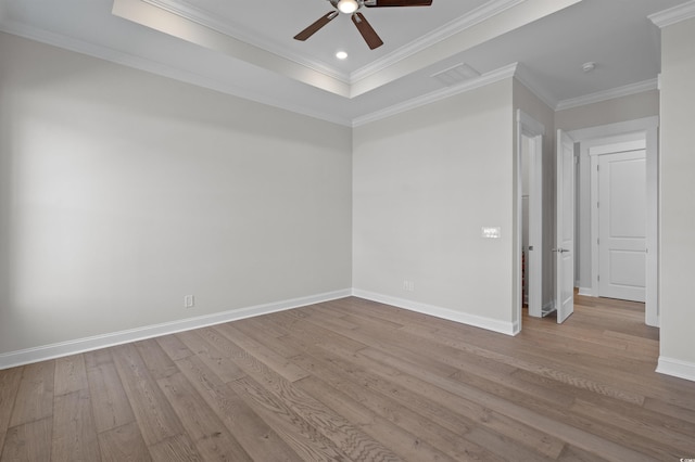 8148 Living Tide Dr, Myrtle Beach, SC 29572 - empty room featuring a ceiling fan, wood finished floors, ornamental molding, a tray ceiling, and a smoke detector