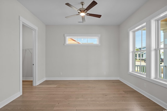 8148 Living Tide Dr, Myrtle Beach, SC 29572 - unfurnished bedroom with multiple windows and light wood finished floors