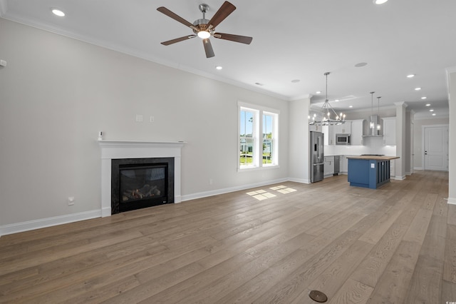 8148 Living Tide Dr, Myrtle Beach, SC 29572 - unfurnished living room featuring ceiling fan, recessed lighting, a glass covered fireplace, light wood-style floors, and ornamental molding