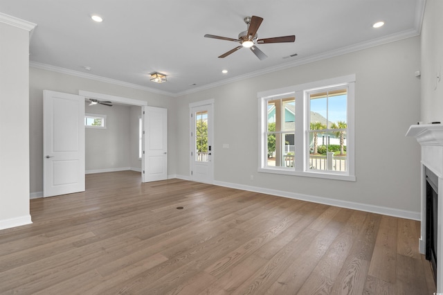 8148 Living Tide Dr, Myrtle Beach, SC 29572 - unfurnished living room with ceiling fan, plenty of natural light, light wood finished floors, a fireplace, and crown molding