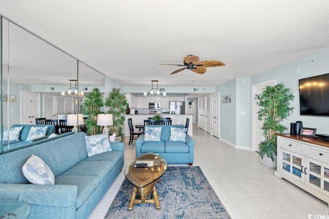 5404 N Ocean Blvd Unit 11-D, North Myrtle Beach, SC 29582 - living area with a chandelier, ceiling fan, a textured ceiling, and light tile patterned floors