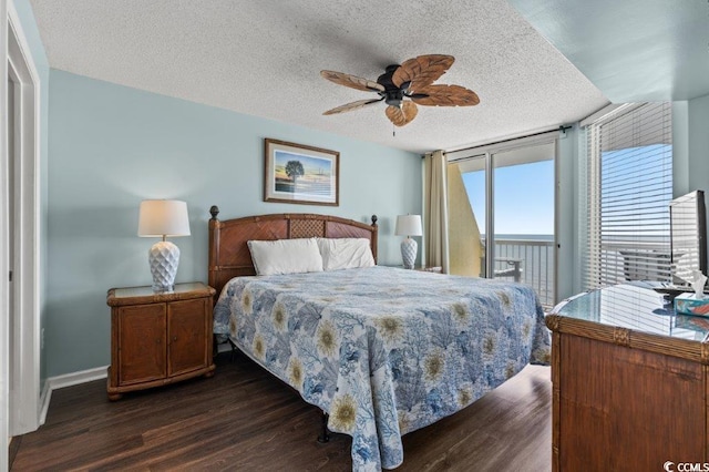 5404 N Ocean Blvd Unit 11-D, North Myrtle Beach, SC 29582 - bedroom featuring access to exterior, dark wood finished floors, a textured ceiling, and ceiling fan