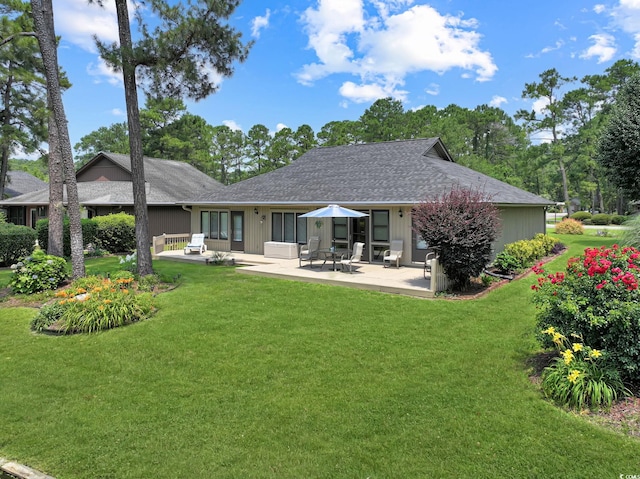 112 Birchwood Ln, Conway, SC 29526 - back of house with a patio area, a lawn, and a shingled roof
