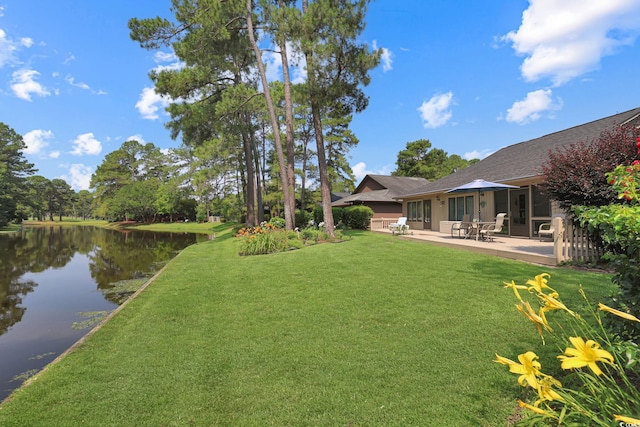 112 Birchwood Ln, Conway, SC 29526 - view of green lawn featuring a water view and a patio area
