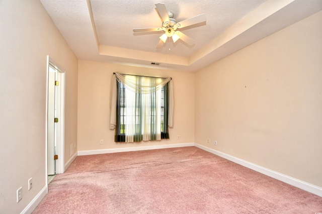 501 Painted Duck Ct, Myrtle Beach, SC 29588 - carpeted spare room featuring a tray ceiling, ceiling fan, and a textured ceiling
