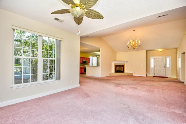 501 Painted Duck Ct, Myrtle Beach, SC 29588 - unfurnished living room featuring light colored carpet, healthy amount of natural light, a chandelier, a tile fireplace, and vaulted ceiling