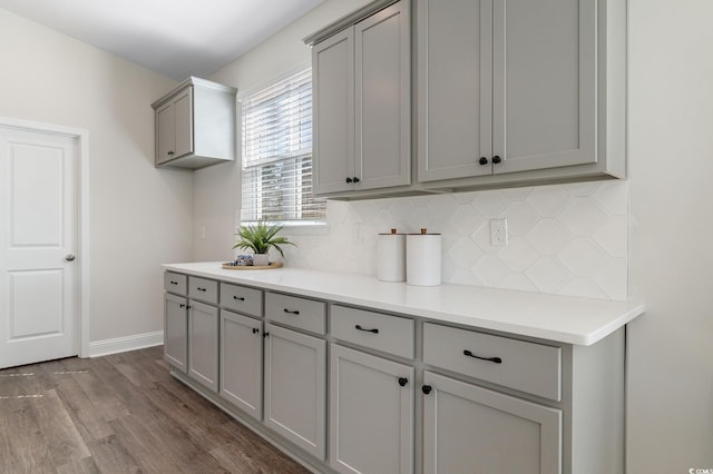 197 Bantry Ln, Conway, SC 29526 - kitchen with gray cabinetry, backsplash, dark wood finished floors, and light countertops