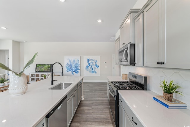 197 Bantry Ln, Conway, SC 29526 - kitchen featuring appliances with stainless steel finishes, light countertops, dark wood-style floors, gray cabinetry, and recessed lighting