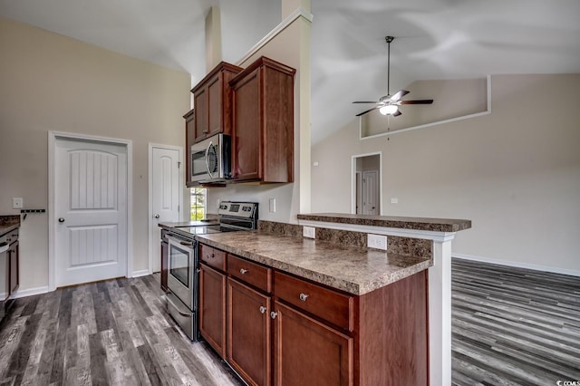 365 Lenox Dr, Conway, SC 29526 - kitchen featuring stainless steel appliances, dark countertops, dark wood-style floors, high vaulted ceiling, and ceiling fan
