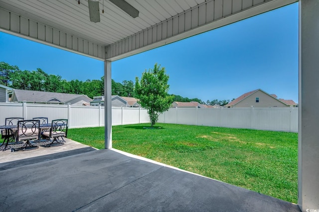 365 Lenox Dr, Conway, SC 29526 - fenced backyard with ceiling fan, a patio area, and outdoor dining space