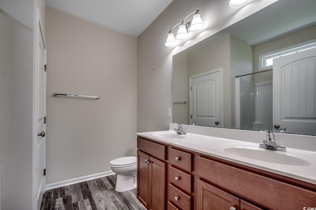 365 Lenox Dr, Conway, SC 29526 - full bathroom featuring wood finished floors, double vanity, and a shower