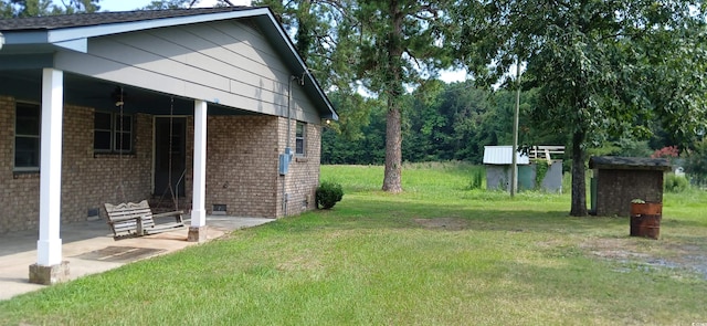 1206 French Rd, Mullins, SC 29574 - view of green lawn featuring a patio