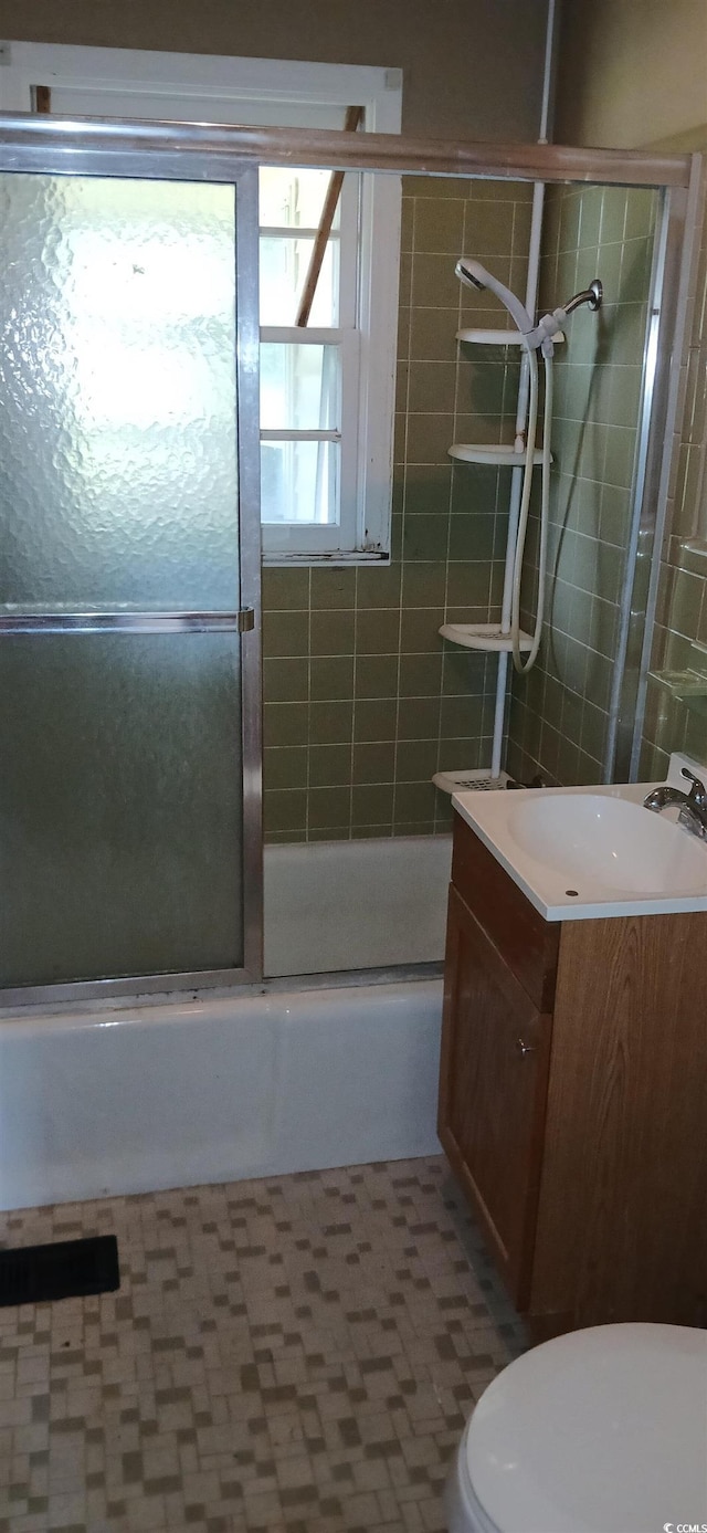 1206 French Rd, Mullins, SC 29574 - bathroom featuring vanity and shower / bath combination with glass door