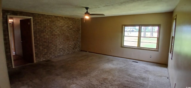 1206 French Rd, Mullins, SC 29574 - spare room with a ceiling fan, carpet, and brick wall