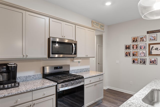 2438 Polaris Path, Myrtle Beach, SC 29577 - kitchen featuring stainless steel appliances, dark wood-type flooring, light stone counters, and recessed lighting
