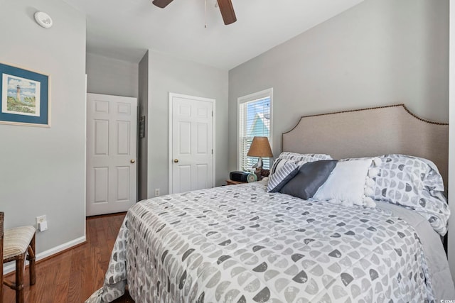 709 Triple Oak Ln, Garden City Beach, SC 29576 - bedroom with dark wood finished floors and ceiling fan