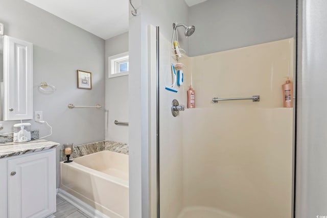 709 Triple Oak Ln, Garden City Beach, SC 29576 - bathroom featuring a shower stall, vanity, and a garden tub