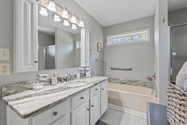 709 Triple Oak Ln, Garden City Beach, SC 29576 - full bathroom featuring vanity, a bath, a stall shower, and marble finish floors