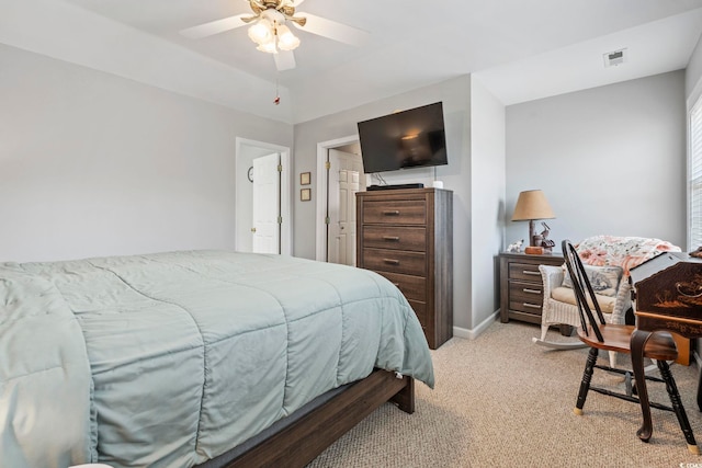 709 Triple Oak Ln, Garden City Beach, SC 29576 - bedroom with light carpet and a ceiling fan