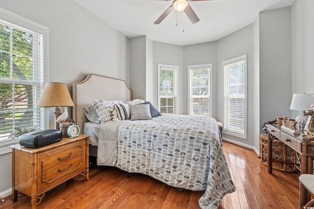 709 Triple Oak Ln, Garden City Beach, SC 29576 - bedroom with light wood-style flooring and ceiling fan