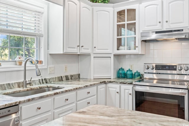 709 Triple Oak Ln, Garden City Beach, SC 29576 - kitchen featuring under cabinet range hood, stainless steel appliances, and white cabinetry